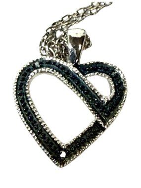 Sterling silver and blue gemstone heart pendant necklace.